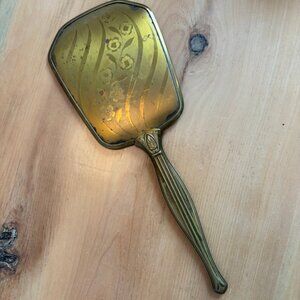 Vintage Art Deco-style brass or gold-toned hand mirror